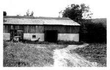 A brick barn with a pigsty