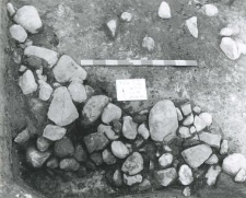 Stones concentration not bonded with any mortar (layer 18) in south-western corner of a plot