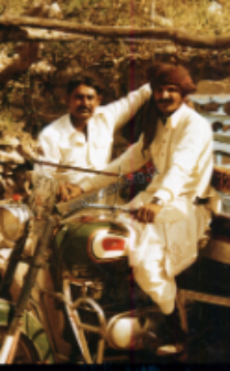 Portrait of two men with motorcycle (Iconographic document)