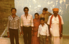 Temple priest with family (Iconographic document)