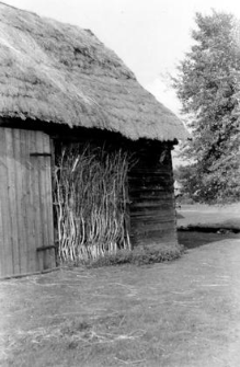 A wall of a log barn