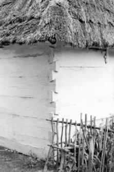 A fragment of a cottage, a fence