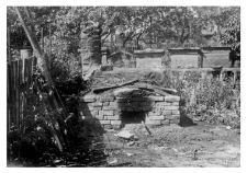 Wooden beehives and a bread oven