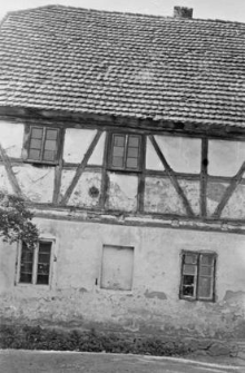 half-timbered, half brick cottage